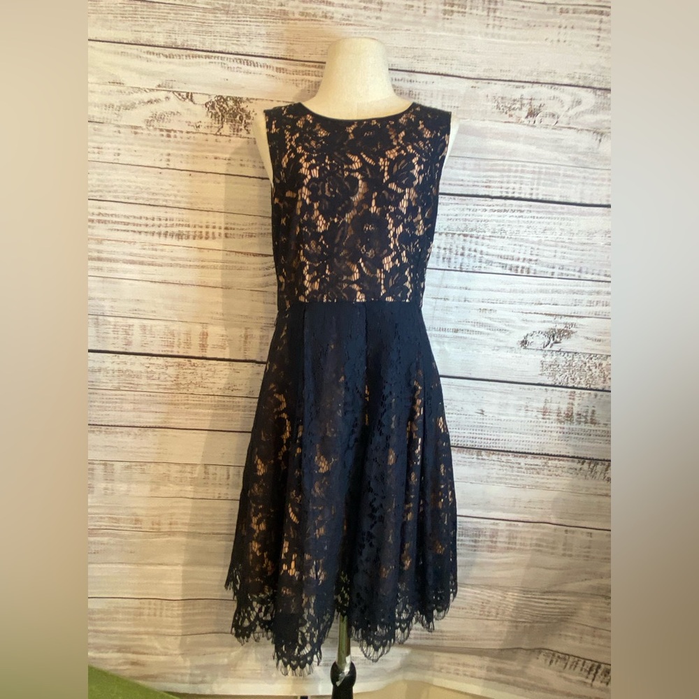 Woman’s lace and nude cocktail dress size 8